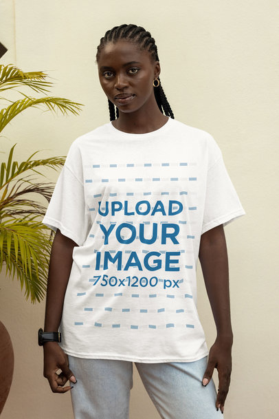 Round-Neck T-Shirt Mockup of a Woman Posing With a Serious Look