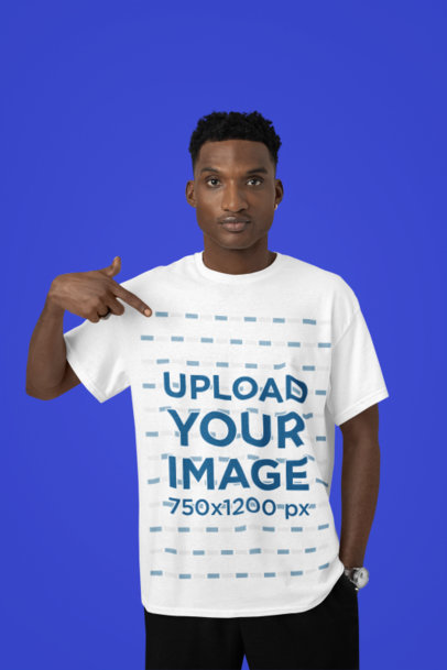 Mockup of a Serious Man Pointing at His Round-Neck T-Shirt