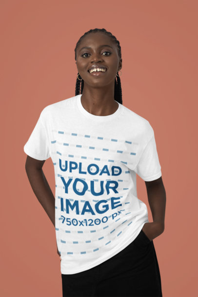 Round-Neck Tee Mockup of a Happy Woman Posing in a Studio With a Colorful Backdrop