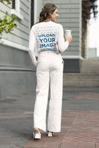 Back-View Bella Canvas Long-Sleeve Tee Mockup Featuring a Happy Woman in a Modest-Styled Outfit