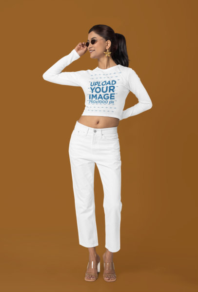 Mockup of a Woman Wearing Sunglasses and a Crop Top T-Shirt with Long Sleeves