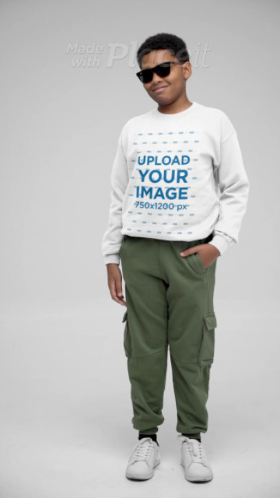 Gildan Crewneck Sweatshirt Video Featuring a Boy Posing With Sunglasses in a Studio