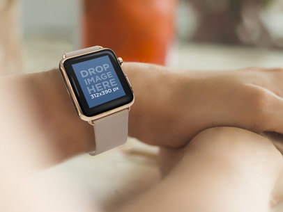 Woman Wearing a Gold and Beige Apple Watch at a Restaurant Mockup