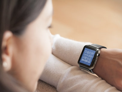 Woman Resting on Sofa Wearing an Apple Watch Mockup -