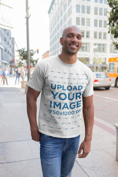 T-Shirt Mockup Featuring a Bald Man Walking in the City