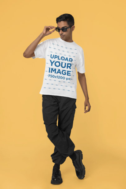 Blinkstore T-Shirt Mockup of a Cool Man Posing in a Studio