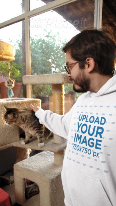 Gildan Hoodie Video Featuring a Smiling Man Petting a Cat