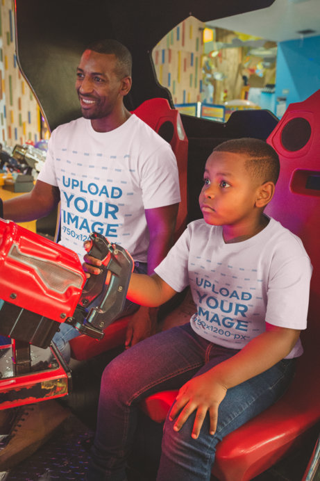T-Shirt Mockup Featuring a Boy Playing with his Father at the Arcade
