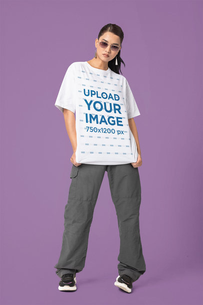 Blinkstore T-Shirt Mockup of a Woman With Sunglasses Posing in a Studio