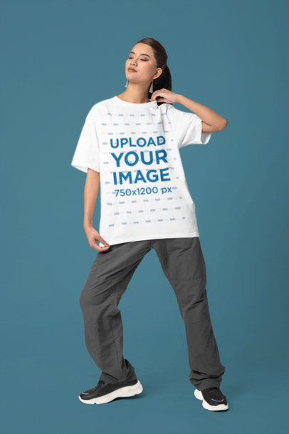 Blinkstore Round-Neck Tee Mockup Featuring a Woman Standing in a Studio