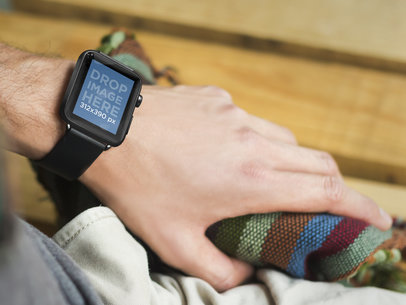 Young Man Wearing Black Apple Watch While Grabbing His Bag