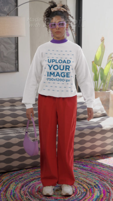 T-Shirt Video of a Woman Wearing a Pullover Hoodie and a Sweatshirt Featuring a Stop Motion Effect