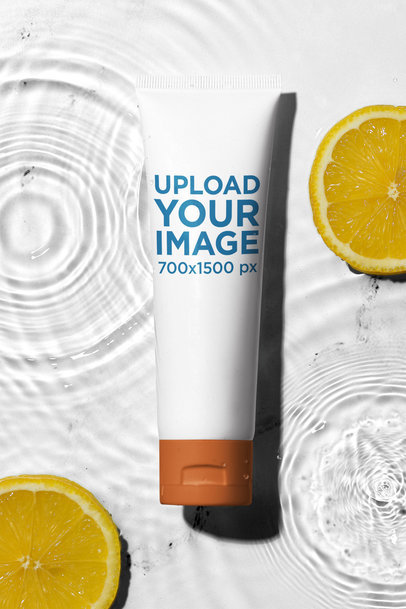 Mockup of a Cosmetic Tube Placed on a Water Surface With Orange Slices m38590