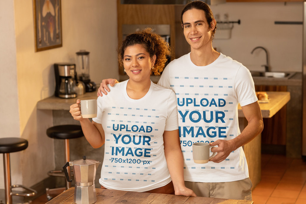 Bella Canvas T-Shirt Mockup Featuring a Smiling Man and Woman Posing With Cups of Coffee