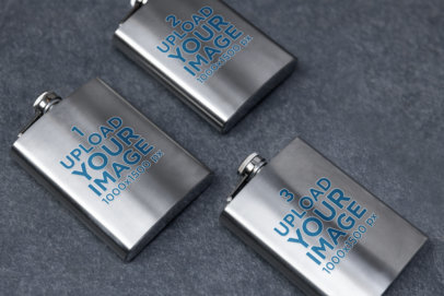 Mockup of Three Aluminum Flasks Placed Face-Up on a Solid Surface m36933
