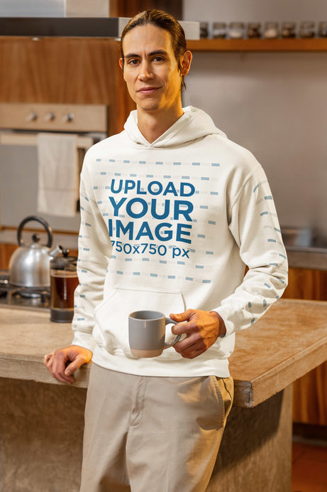 Gildan Hoodie Mockup Featuring a Smiling Man Posing With a Cup of Coffee