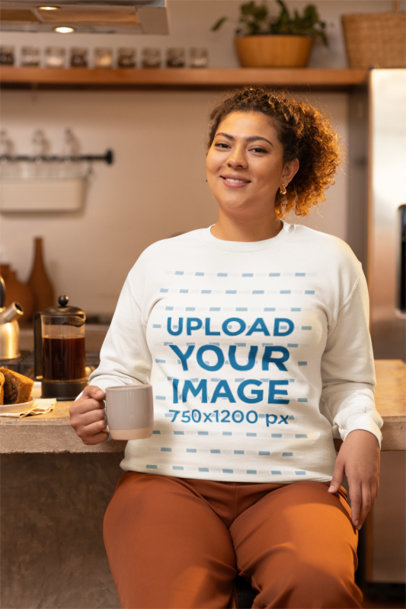 Gildan Sweatshirt Mockup Featuring a Cheerful Woman Posing With a Cup of Coffee