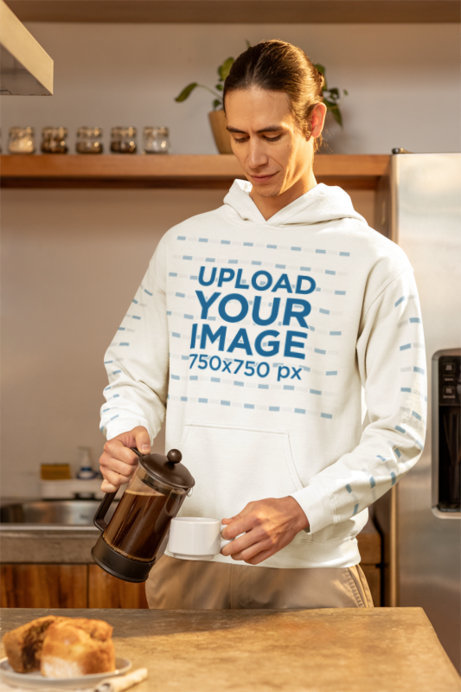 Gildan Pullover Hoodie Mockup Featuring a Man Serving Coffee in a Cup