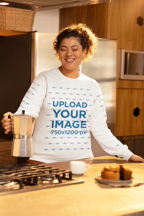 Gildan Sweatshirt Mockup of a Joyful Woman Serving Coffee in a Kitchen