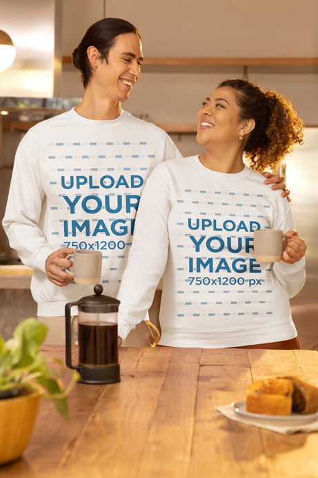 Gildan Sweatshirt Mockup of a Joyful Man and Woman Hugging Each Other While Drinking Coffee