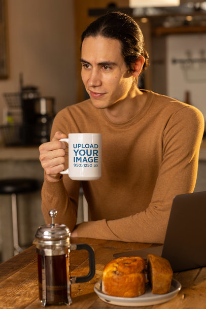 Coffee Mug Mockup Featuring a Smiling Man Leaning on a Wooden Table