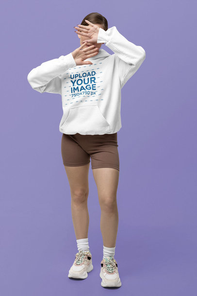 Gildan Pullover Hoodie Mockup Featuring a Woman Posing With Her Hands on Her Face