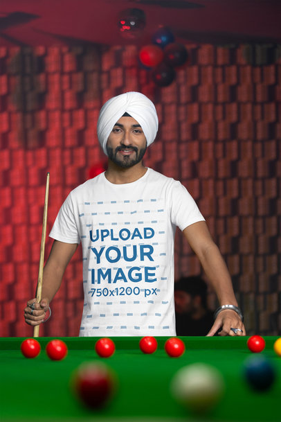 Scott International T-Shirt Mockup of a Man With a Turban Playing Pool
