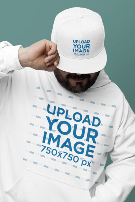 Snapback Hat Mockup Featuring a Bearded Man Wearing a Gildan Hoodie in a Studio