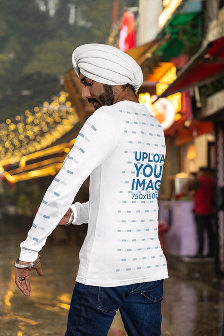 Mockup of a Man with a Turban Wearing a Bella Canvas Tee with a Customizable Sleeve