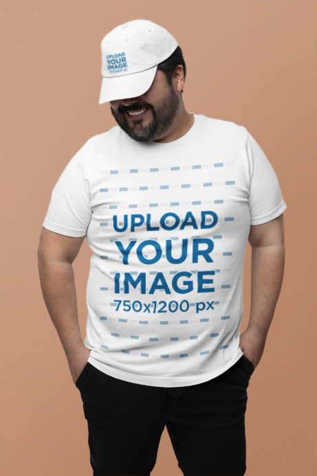 Dad Hat and Bella Canvas Tee Mockup of a Cheerful Bearded Man Posing in a Studio