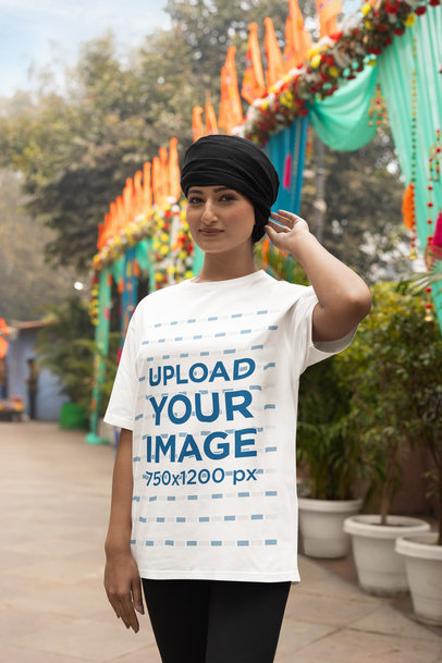 Round-Neck Tee Mockup of a Happy Woman Wearing a Turban on a Street