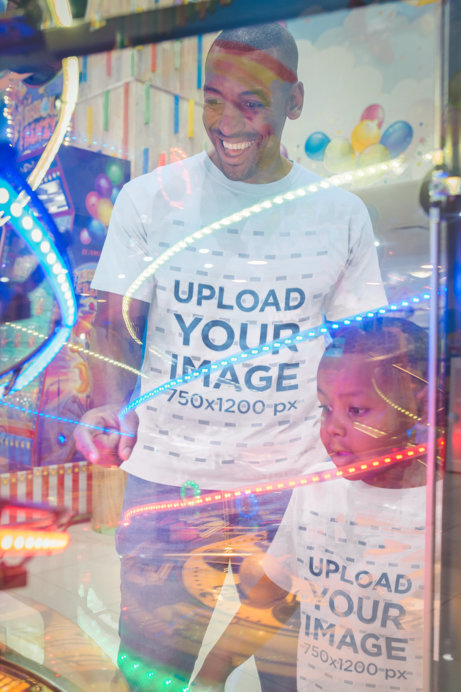 Mockup of a Man Wearing T-Shirts with his Son at the Video Arcade
