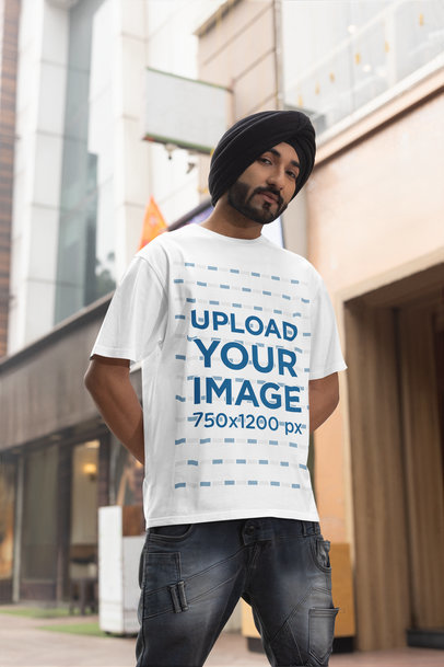Blinkstore T-Shirt Mockup of a Bearded Man Wearing a Turban on the Street m38636