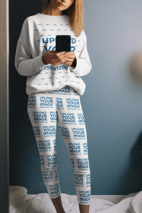 Sweatshirt and Leggings Mockup Featuring an AI-Created Woman Taking a Mirror Selfie