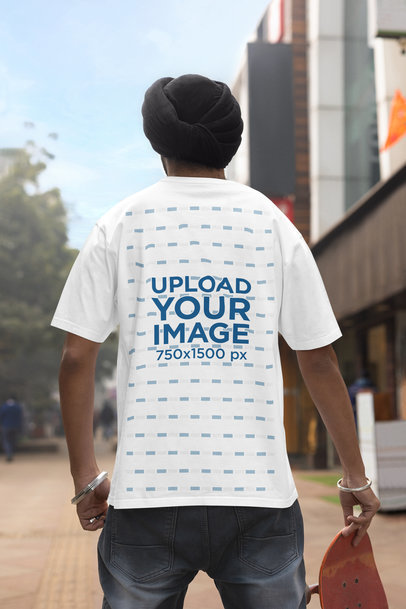 Back-View Blinkstore T-Shirt Mockup of a Man With a Turban Standing in a Street