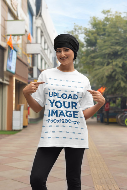 Blinkstore Mockup Featuring a Happy Woman Pointing at Her T-Shirt