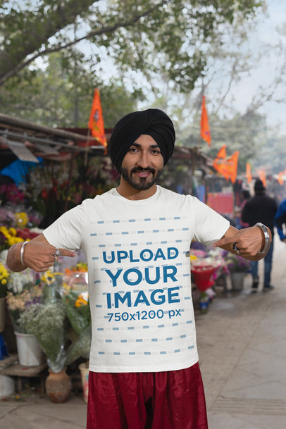 Mockup of a Happy Bearded Man with a Turban Pointing at His Scott International Tee