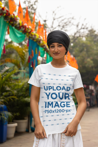 Scott International T-Shirt Mockup of a Smiling Woman With a Turban Standing by the Street m38698
