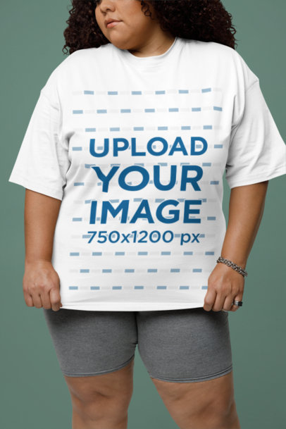 Oversized Tee Mockup Featuring a Cropped-Face Woman Standing in a Studio