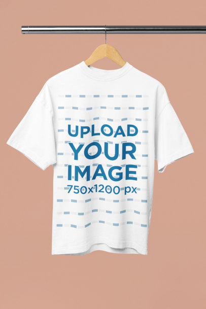 Mockup of an Oversized T-Shirt Placed on a Wooden Hanger