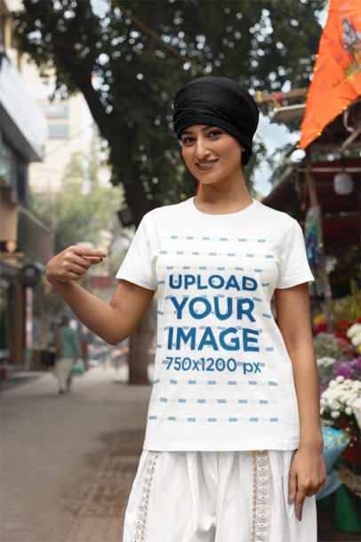 Mockup of a Woman with a Turban Pointing at Her New Scott International T-Shirt m38678