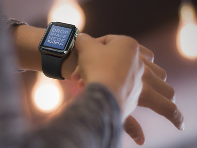 Close-up Mockup of a Young Man Using his Apple Watch Out at Night "