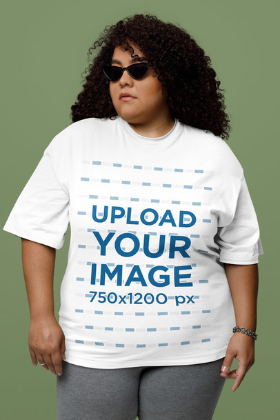 Oversized T-Shirt Mockup Featuring a Serious Curly-Haired Woman With Sunglasses