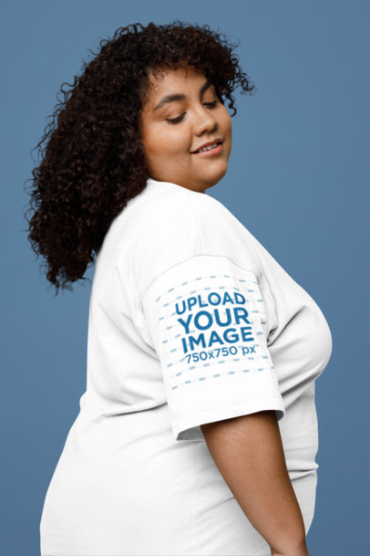 T-Shirt Sleeve Mockup of a Smiling Woman Posing in a Studio