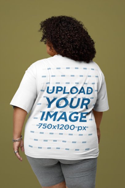 Back-View Mockup of a Woman Wearing an Oversized T-Shirt in a Studio