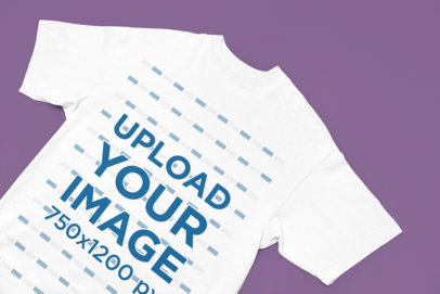 Mockup of an Oversized Round-Neck T-Shirt Lying on a Flat Surface