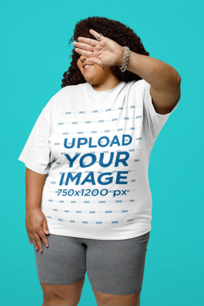 Mockup of a Curly-Haired Woman Wearing a Plus Size T-Shirt in a Studio