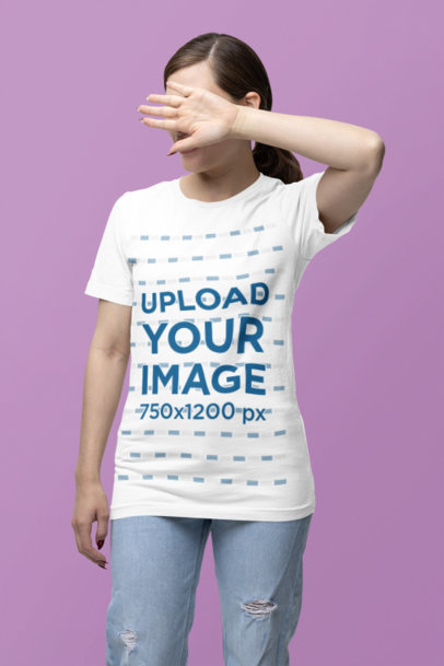 Bella Canvas T-Shirt Mockup of a Woman Covering Her Face With Her Hand in a Studio m38535