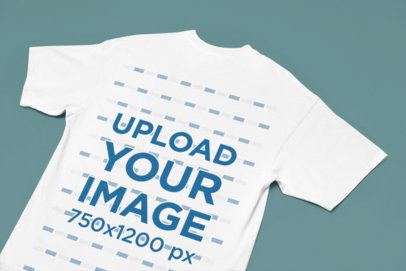 Back-View Mockup of an Oversized T-Shirt Flat Laid over a Solid Surface m38920