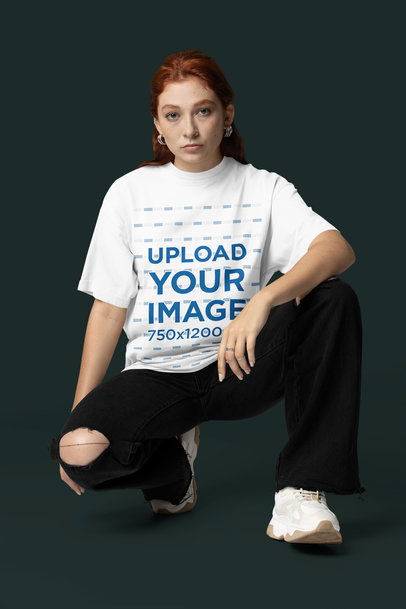 Mockup of a Woman Wearing an Oversized T-Shirt with a Crew Neck in a Studio